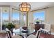 Dining room featuring elegant chandelier and access to the outside balcony at 5823 Bowen Daniel Dr # 606, Tampa, FL 33616
