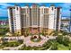 Stunning exterior view of a luxurious high-rise condo building with elegant architecture and lush landscaping at 5823 Bowen Daniel Dr # 606, Tampa, FL 33616