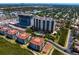 Waterfront community features mature landscaping, a sparkling pool, and multiple condo buildings at 5823 Bowen Daniel Dr # 606, Tampa, FL 33616