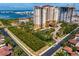 Beautiful building features lush landscaping, porte cochere, and water views in a serene waterfront setting at 5823 Bowen Daniel Dr # 606, Tampa, FL 33616