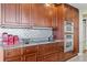 Well-equipped kitchen with custom cabinetry and modern stainless steel appliances at 5823 Bowen Daniel Dr # 606, Tampa, FL 33616