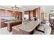 Open kitchen with granite countertops, stainless steel appliances, and breakfast bar at 5823 Bowen Daniel Dr # 606, Tampa, FL 33616