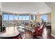 Spacious living room with floor-to-ceiling windows and hardwood floors at 5823 Bowen Daniel Dr # 606, Tampa, FL 33616