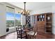 Bright office with wood floors, large bookcase, and a sliding door leading to the balcony at 5823 Bowen Daniel Dr # 606, Tampa, FL 33616