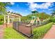 Community playground with a slide, climbing structure and shaded seating area, perfect for families at 5823 Bowen Daniel Dr # 606, Tampa, FL 33616