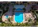 Aerial view of the community pool, jacuzzi, seating, and landscaping at 5823 Bowen Daniel Dr # 606, Tampa, FL 33616