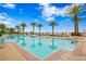 Community pool area with clear blue water, brick pavers, and lounge chairs at 5823 Bowen Daniel Dr # 606, Tampa, FL 33616
