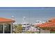 Scenic view of the harbor featuring boat slips, sailboats and other vessels and palm trees at 5823 Bowen Daniel Dr # 606, Tampa, FL 33616