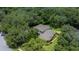 Expansive aerial view of a beautiful home surrounded by lush trees and manicured landscaping at 5902 Audubon Manor Blvd, Lithia, FL 33547