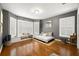 Cozy bedroom with hardwood floors, bay window, and custom daybed at 5902 Audubon Manor Blvd, Lithia, FL 33547