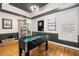 Entertainment room with a foosball table and view to the dining and kitchen areas at 5902 Audubon Manor Blvd, Lithia, FL 33547
