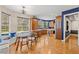 Open concept kitchen featuring a breakfast nook, wooden cabinetry and trim, and hardwood flooring at 5902 Audubon Manor Blvd, Lithia, FL 33547
