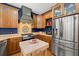 Spacious kitchen featuring custom cabinets, stainless steel appliances, and a decorative backsplash at 5902 Audubon Manor Blvd, Lithia, FL 33547