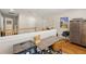Upstairs landing featuring hardwood floors, a desk area, and a display cabinet at 5902 Audubon Manor Blvd, Lithia, FL 33547