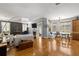 Bright living room with hardwood floors, fireplace, and ample natural light from large windows at 5902 Audubon Manor Blvd, Lithia, FL 33547