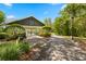 Charming community pavilion nestled among lush trees and landscaping, with a convenient paved walkway at 5902 Audubon Manor Blvd, Lithia, FL 33547