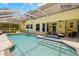 Beautiful screened-in pool with ample seating, perfect for entertaining guests at 5902 Audubon Manor Blvd, Lithia, FL 33547