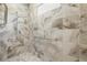 Accessible walk-in shower with stylish tile work and convenient grab bars for added safety and comfort at 5902 Audubon Manor Blvd, Lithia, FL 33547