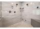 Luxurious walk-in shower featuring multiple shower heads and a tile surround at 5902 Audubon Manor Blvd, Lithia, FL 33547