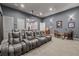 Spacious home theater equipped with reclining seats, high-definition projector, and sound system at 5902 Audubon Manor Blvd, Lithia, FL 33547