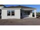 New construction home featuring a minimalist exterior with a covered patio, enhancing outdoor living at 6270 Broad Field Ave, Apollo Beach, FL 33572