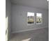 Bright bedroom with two large windows offering natural light and views of the neighborhood at 6270 Broad Field Ave, Apollo Beach, FL 33572