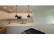 Bright kitchen with white cabinets, a spacious island, and modern pendant lighting fixtures at 6270 Broad Field Ave, Apollo Beach, FL 33572