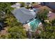 Aerial view showcasing the house, pool, and lush surrounding landscape at 628 Bosphorous Ave, Tampa, FL 33606