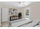 Tastefully decorated bedroom with neutral tones, backyard access, and tiled floors at 628 Bosphorous Ave, Tampa, FL 33606
