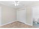 Bedroom featuring tiled floors, ceiling fan, and white closet doors with connecting bathroom with blue tile at 628 Bosphorous Ave, Tampa, FL 33606