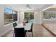 Bright dining room offering an expansive view of the pool and backyard at 628 Bosphorous Ave, Tampa, FL 33606
