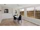 Bright dining room featuring large windows and access to the backyard at 628 Bosphorous Ave, Tampa, FL 33606