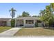 Delightful single-Gathering home with a convenient carport, lush lawn, and inviting curb appeal at 628 Bosphorous Ave, Tampa, FL 33606