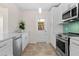 Bright kitchen featuring stainless steel appliances, and access to the backyard at 628 Bosphorous Ave, Tampa, FL 33606
