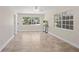 Open-concept living room with tile floors, large windows, and bright, airy feel at 628 Bosphorous Ave, Tampa, FL 33606