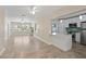 Bright open-concept space adjoining a modern kitchen with a breakfast bar and updated appliances at 628 Bosphorous Ave, Tampa, FL 33606