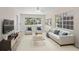 Stylishly furnished living room featuring a comfortable seating arrangement and natural light at 628 Bosphorous Ave, Tampa, FL 33606