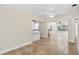 Bright, open-concept living room features tile flooring and ceiling fans at 628 Bosphorous Ave, Tampa, FL 33606