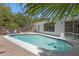 A backyard pool, patio and tropical landscaping at 628 Bosphorous Ave, Tampa, FL 33606