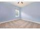 Bedroom with a window, neutral carpet, and light blue walls at 6524 Park Strand Dr, Apollo Beach, FL 33572