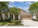 Charming single-story home with a well-manicured front yard and two-car garage at 6524 Park Strand Dr, Apollo Beach, FL 33572