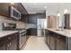 Well-equipped kitchen featuring stainless steel appliances and granite countertops at 6524 Park Strand Dr, Apollo Beach, FL 33572