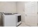 Dedicated laundry room with modern Samsung washer and dryer units at 6524 Park Strand Dr, Apollo Beach, FL 33572