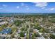 Beautiful aerial view of home nestled in a quiet, green neighborhood, near the bay and city amenities at 6821 Date Palm S Ave, St Petersburg, FL 33707