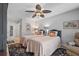 Comfortable bedroom with two twin beds, ceiling fan and ensuite bathroom at 6821 Date Palm S Ave, St Petersburg, FL 33707