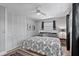 Charming bedroom features a large closet, ceiling fan, modern window treatment, and a comfortable queen-sized bed at 6821 Date Palm S Ave, St Petersburg, FL 33707