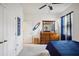 Bright bedroom with wood dresser, coastal decor, and ample natural light at 7323 Steer Blade Dr, Zephyrhills, FL 33541