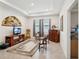 Cozy room featuring tile flooring, ample natural light, and tasteful furnishings at 7323 Steer Blade Dr, Zephyrhills, FL 33541