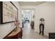 Inviting foyer features elegant tile flooring, recessed lighting, and tasteful decor throughout at 7323 Steer Blade Dr, Zephyrhills, FL 33541