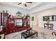 Living room featuring decorative furnishings, a ceiling fan, and ceramic tile flooring at 7323 Steer Blade Dr, Zephyrhills, FL 33541